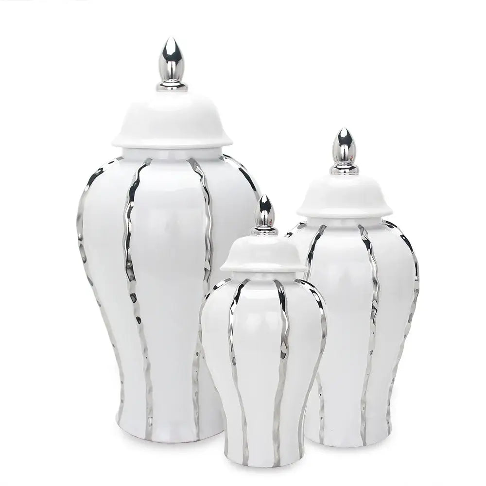 Set of three white ceramic ginger pot vases with silver metallic accents and matching lids for modern living room decor