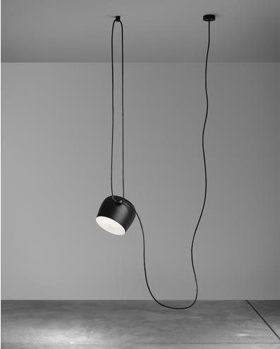 Black cylindrical pendant light with long cord and minimalist design.