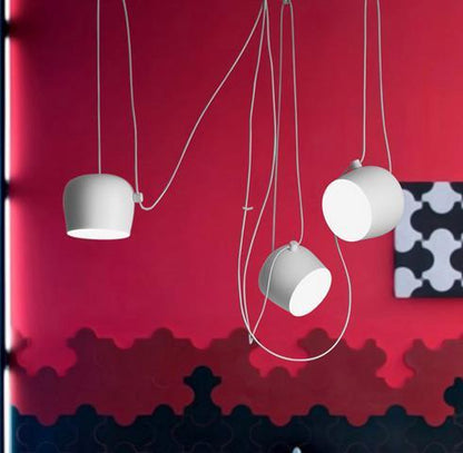 White ceramic pendant light with minimalist design and modern appeal.