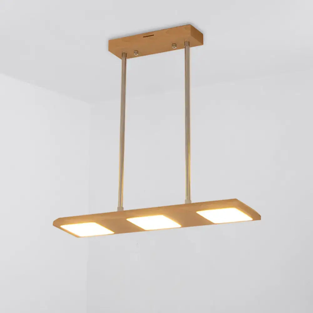 Modern simple rectangle wood island lamp with three warm led panels in a wooden frame for dining room lighting