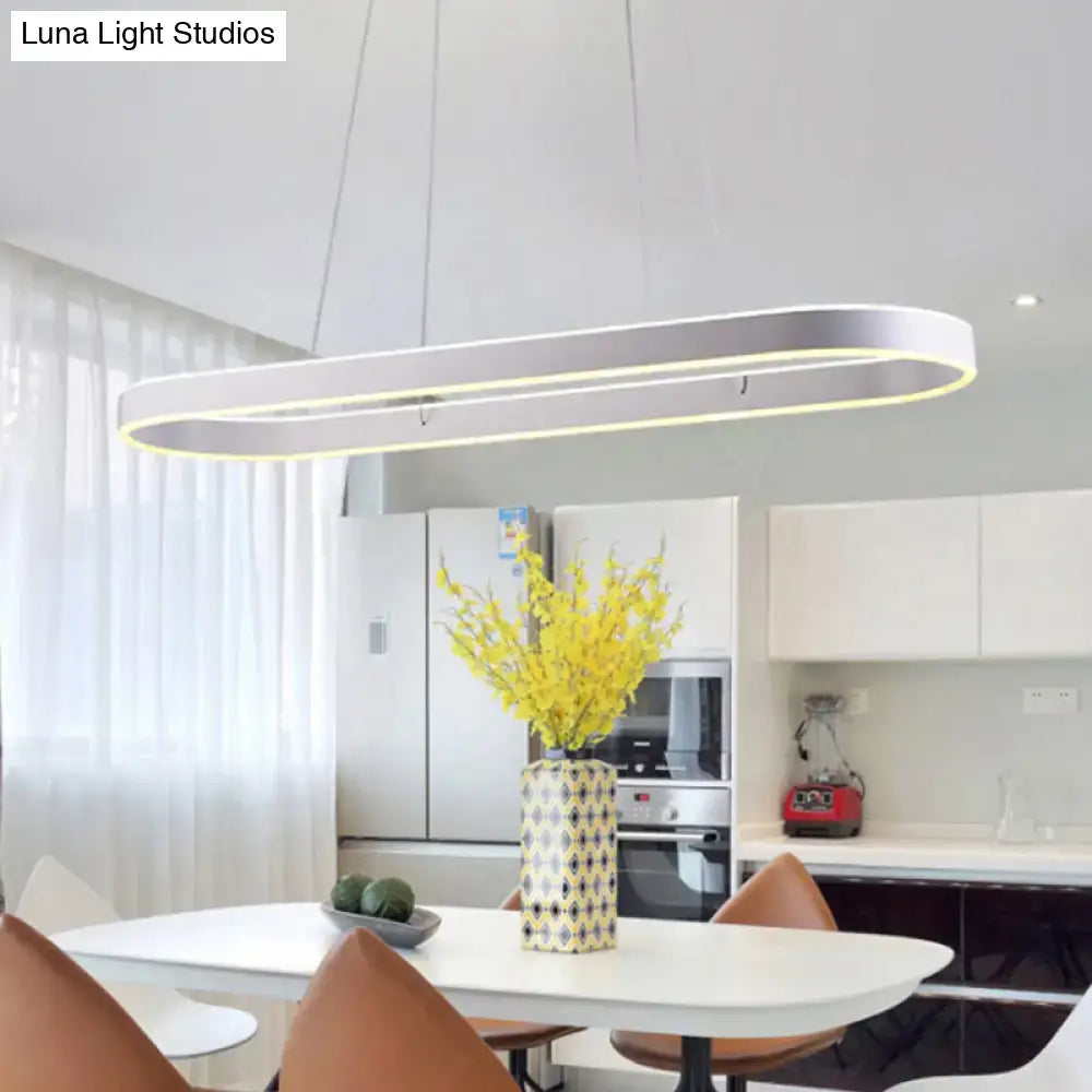 Modern simplicity ellipse led island pendant ceiling light with a sleek silver metallic frame and warm led lighting