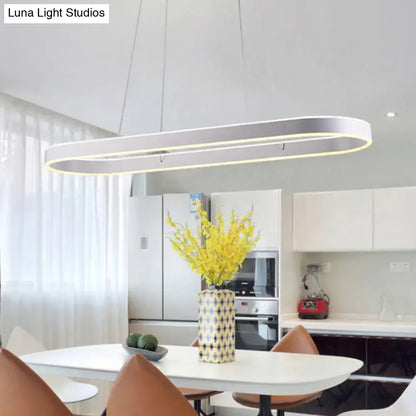 Modern simplicity ellipse led island pendant ceiling light with a sleek silver metallic frame and warm led lighting