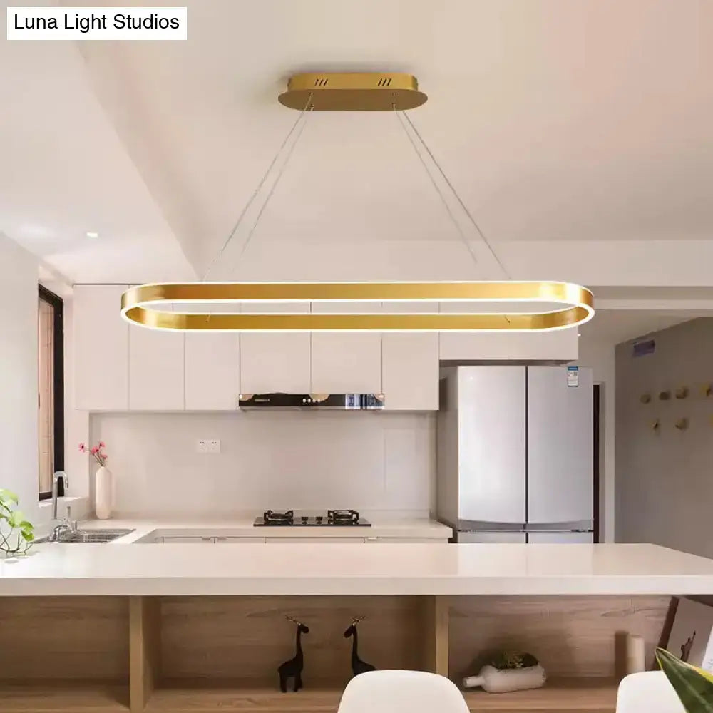 Gold-colored oval ceiling light with sleek modern design simplicity ellipse led island pendant for kitchen use