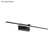 Modern sleek black led wall light with rectangular fixture providing warm white light for bathroom use