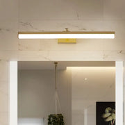 Modern sleek brass finish wall light fixture with gold rectangular led design mounted above bathroom vanity mirror