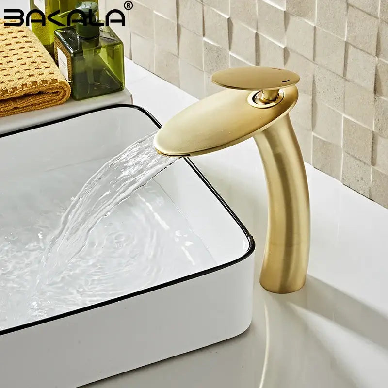Modern sleek gold waterfall basin faucet with a contemporary design for elegant bathroom decor