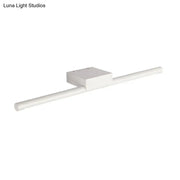 Modern slim white led light fixture with a cylindrical bar providing warm light for bathroom walls