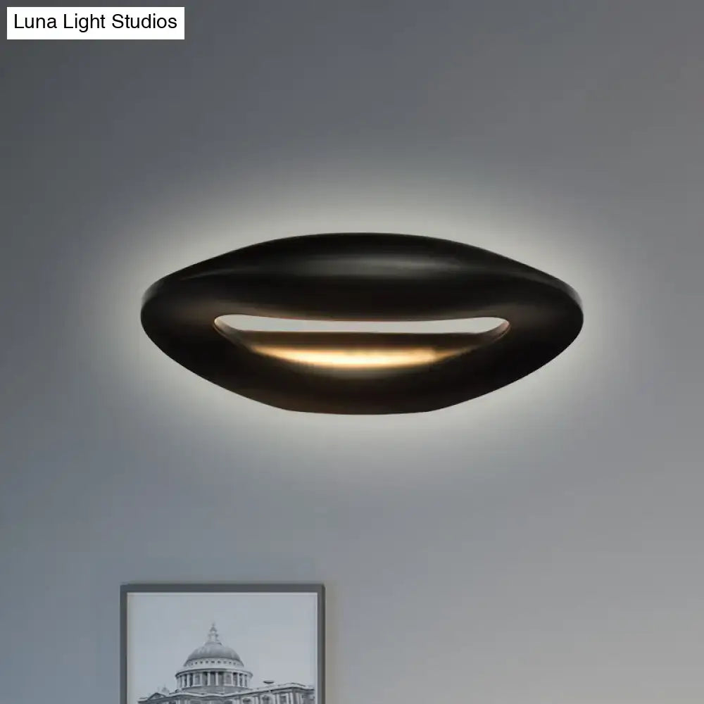 Modern black white smiling face led wall lamp with oval ceiling light design and warm ambient glow for corridors