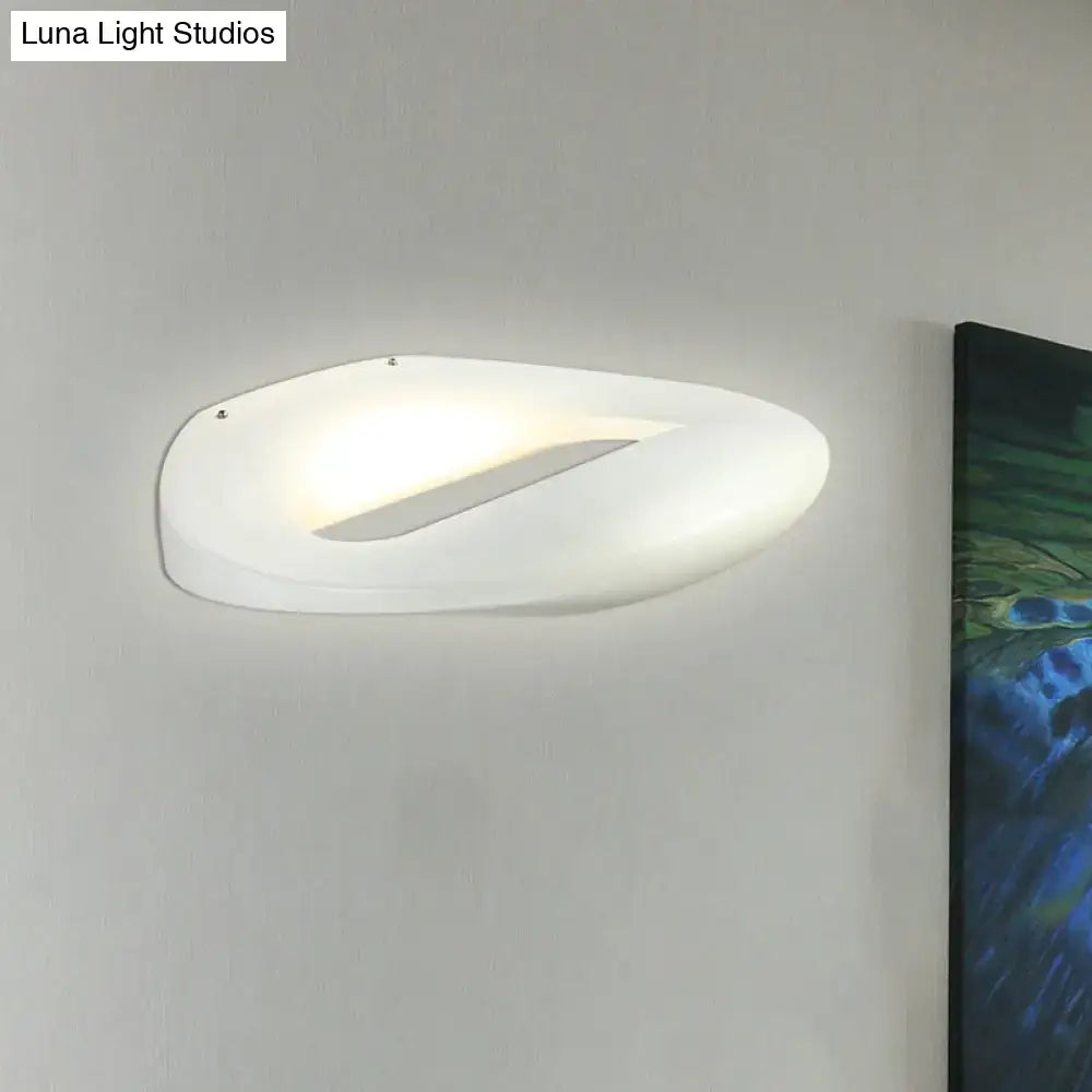 Modern smiling face wall lamp with sleek oval design and frosted glass finish in black and white for corridor lighting