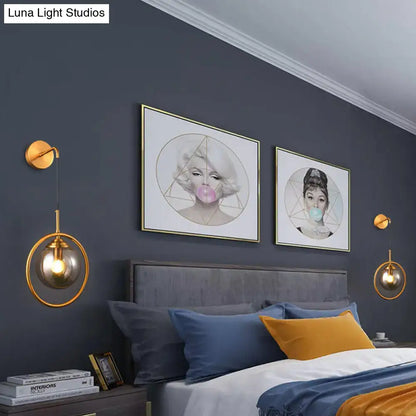 Gold-toned modern smoke gray clear glass globe sconce with hanging chain for bedroom wall light 220v-240v 110v-120v