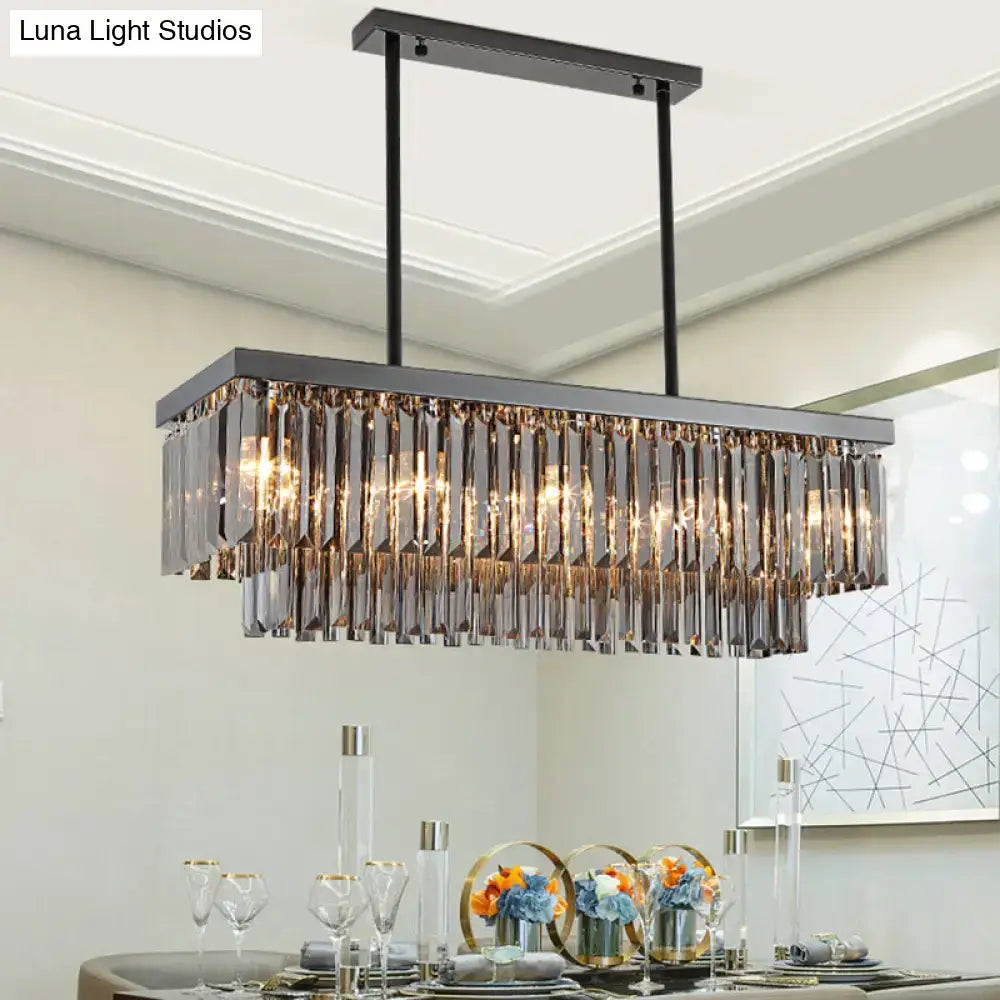 Modern smoke gray crystal rectangle chandelier with sleek black metal frame and gray crystal block prisms for dining room