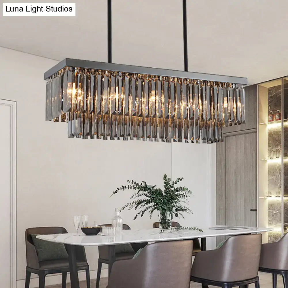 Modern smoke gray crystal rectangle chandelier with sleek metallic frame and cascading gray crystal block prisms for dining room