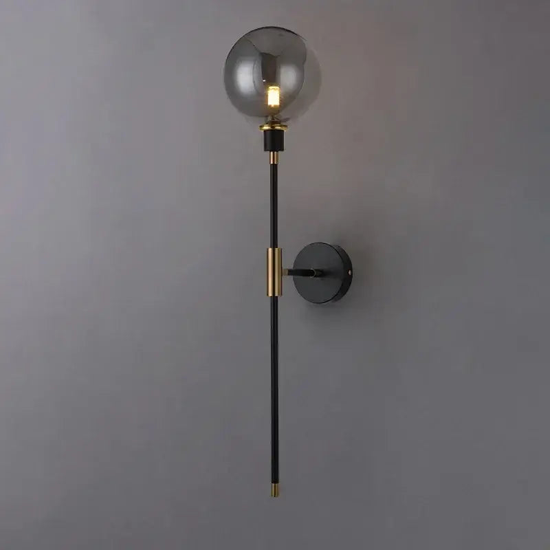 Modern smoked glass ball led wall light with black metal rod and brass accents for elegant bedroom wall light decorbites glass ball