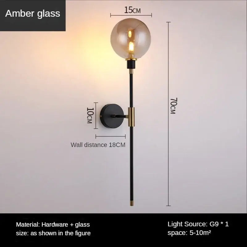 Modern smoked glass ball led wall light with amber glass globe and black brass finish for bedroom decorbites glass ball sconce