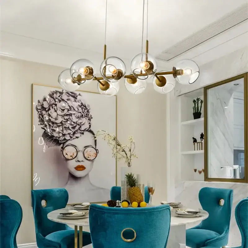 Modern smoked glass ball pendant lights featuring clear glass globes and gold-toned metal arms for dining room decorbites glass ball pendant lights