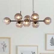 Modern smoked glass ball pendant lights with sleek black metal frame ideal for dining room decorbites glass ball decor