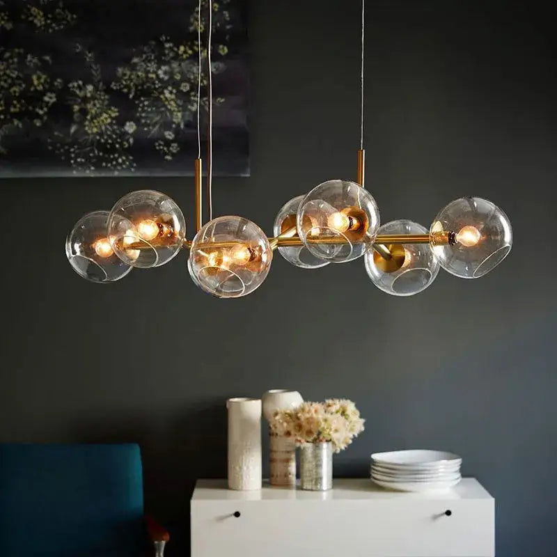 Gold-toned modern pendant lights with clear glass globe shades decorbites glass ball pendant for dining room decor