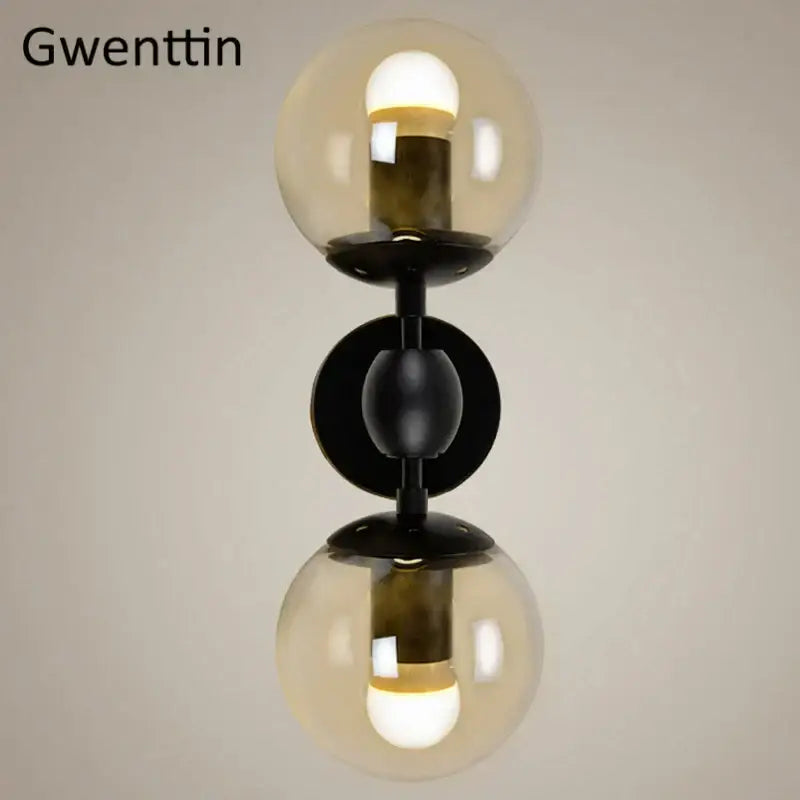 Gwenttin double globe glass beans wall lamp with black metal frame and amber smoked glass for modern bedroom decorbites lighting