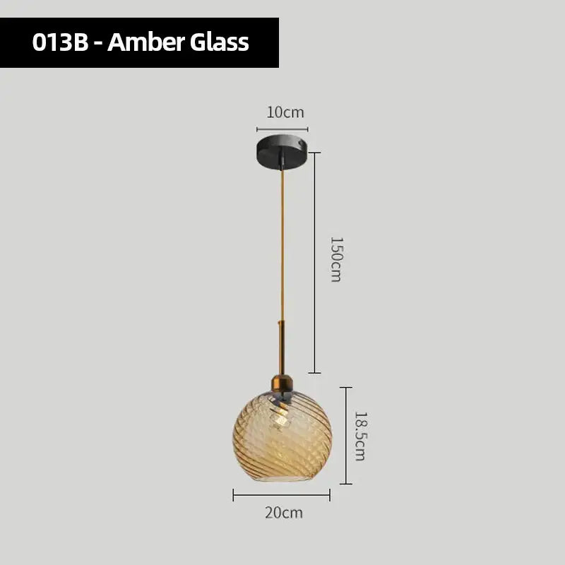 Amber glass chandelier pendant lights set of 4 with twisted textured globes and brass-toned hardware for kitchen use
