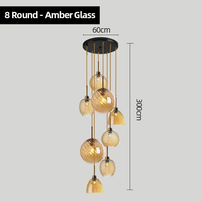 Modern smoked glass chandelier pendant lights set of 4 featuring amber glass spheres and brass rods for kitchen lighting