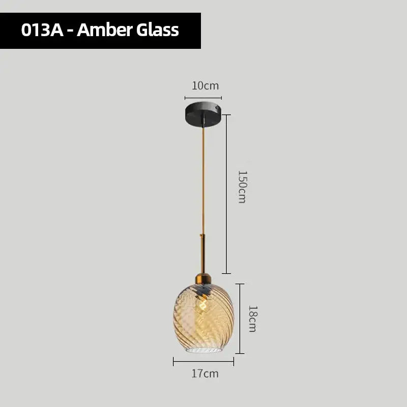 Modern smoked glass chandelier pendant lights set of 4 with amber glass twisted globe and brass-toned metal hardware for kitchen
