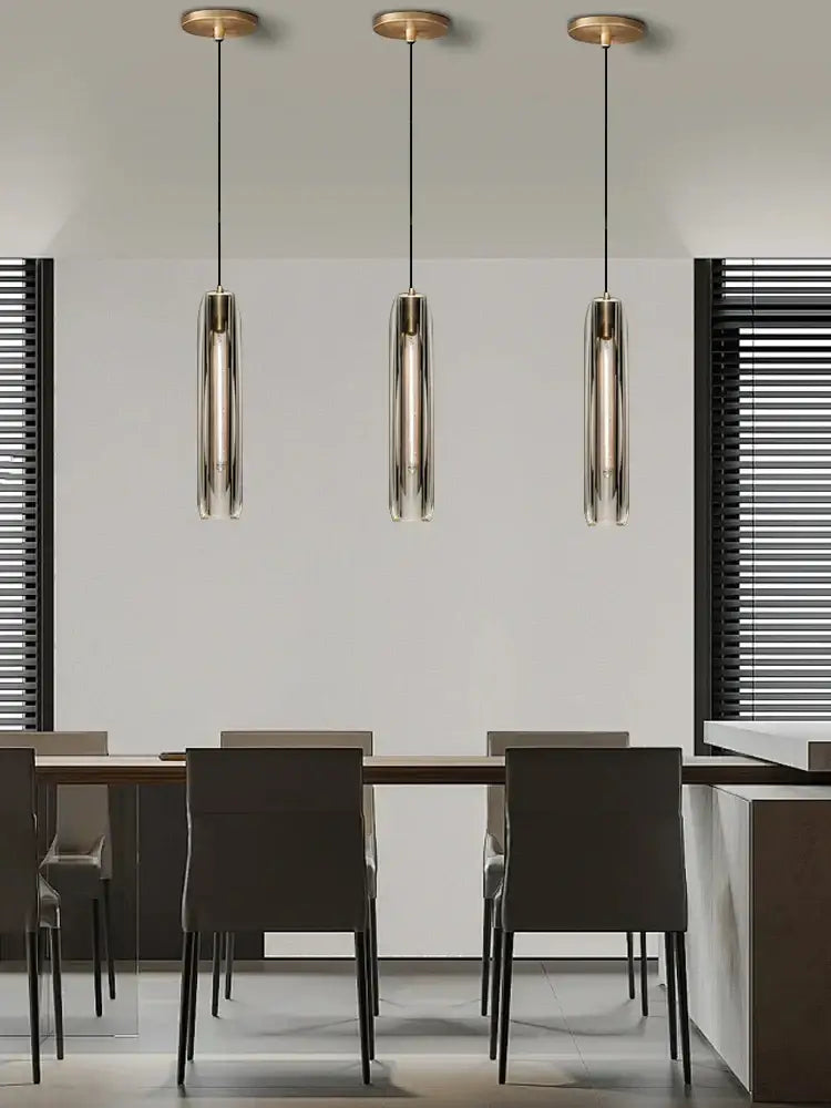 Three modern pendant lights with smoky glass shades and brass tops for dining room decorbites crystal copper pendant