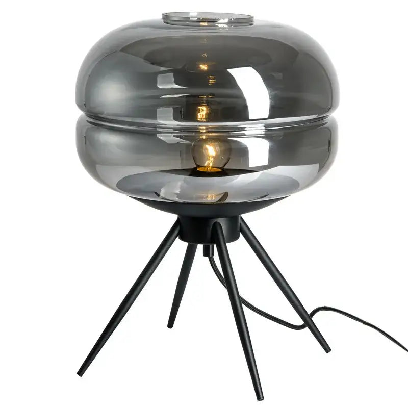 Modern smoked glass desk lamp with a sleek layered dome and black metal tripod base for decorbites glass desk use