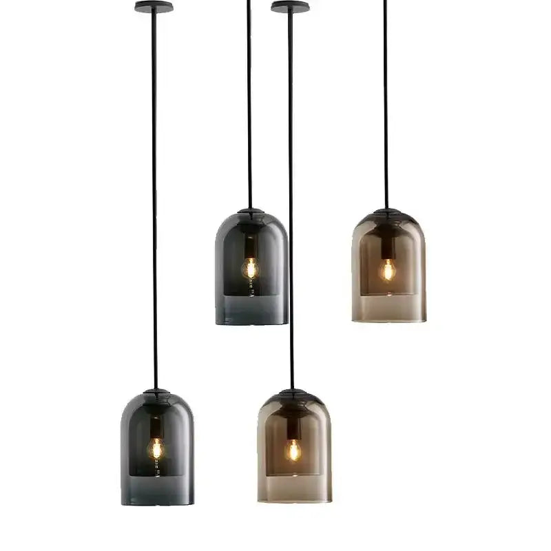 Set of four modern glass led chandelier pendant lights with smoked glass bell-shaped shades and black cords for dining room