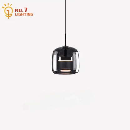 Modern smoked glass pendant lights featuring black glass pendant lights with sleek minimalist metal accents for bedroom lighting