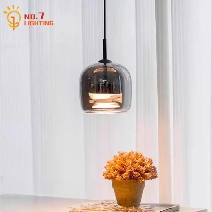 A sleek modern smoked glass pendant light with black metal fixture for bedroom led lighting pendant lights