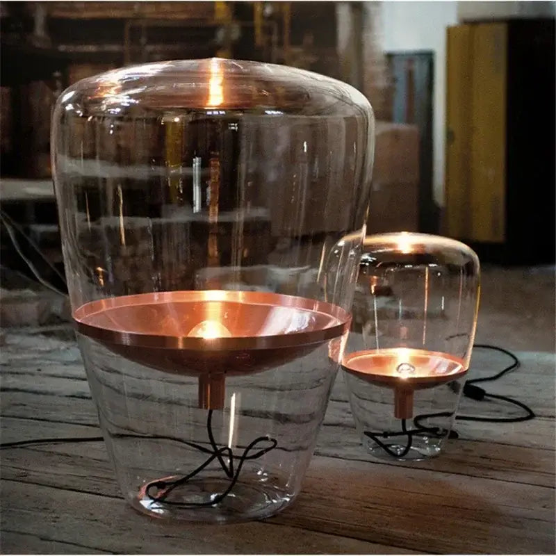 Modern smoked glass table lamp with clear glass shade and copper metal base for bedroom or desk lighting