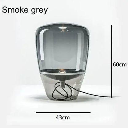 Smoke grey glass table lamp with sleek modern design and metallic base ideal as a bedroom led desk light