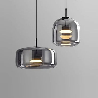 Modern smoked gray glass led pendant chandelier with warm circular bulbs and sleek black cords for dining room lighting