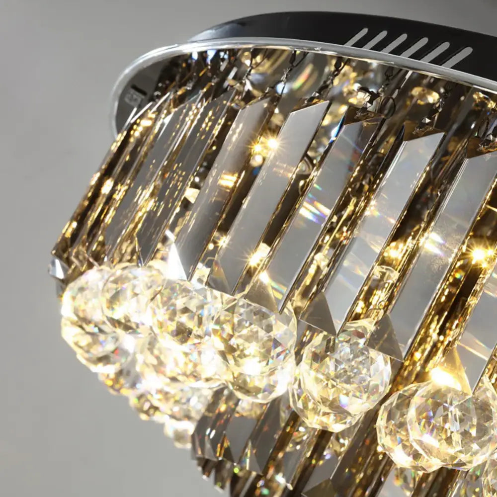 Modern smoky gray and gold decorbites crystal led chandelier with chrome frame and cascading rectangular and round prisms