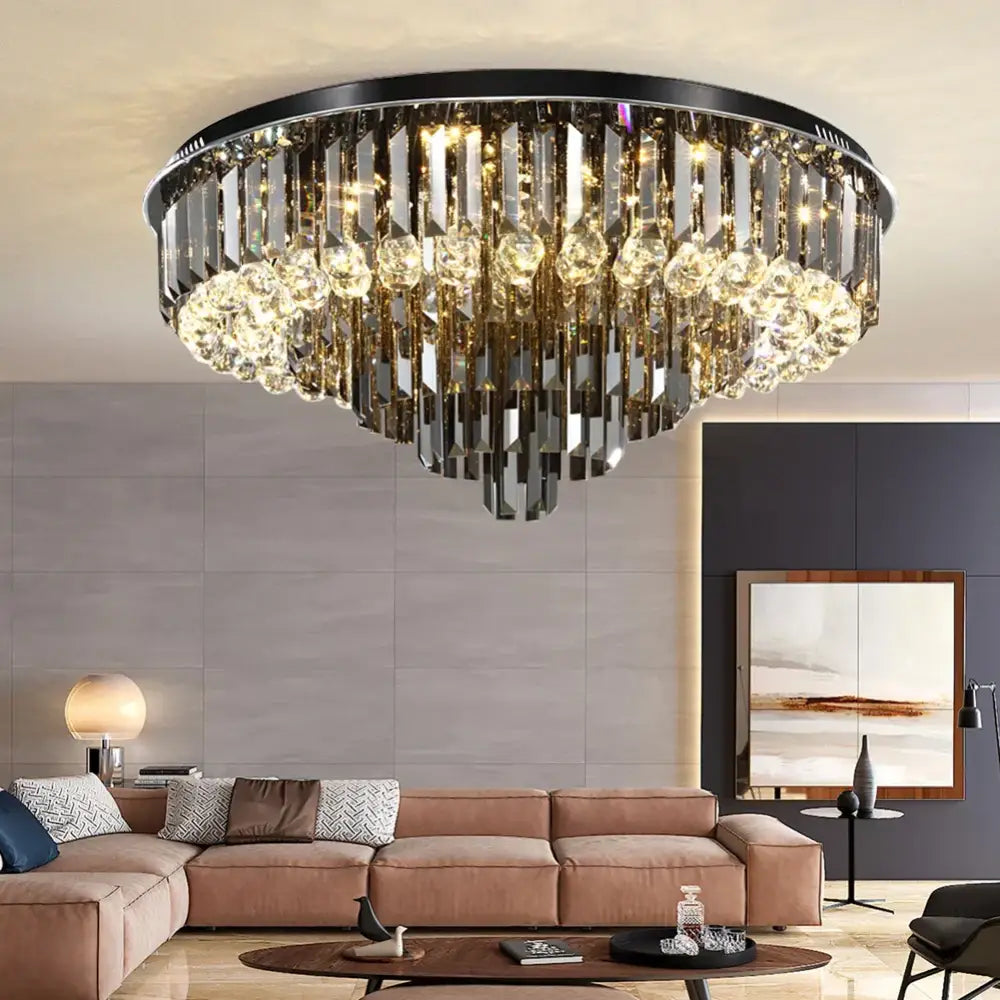 Modern smoky gray and gold decorbites crystal led chandelier with black metal frame and cascading sparkling crystals for living room decor