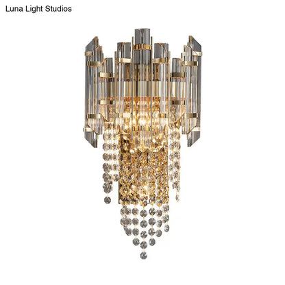 Gold and silver-toned smoky grey crystal chandelier with vertical glass rods and cascading faceted beads for living room light