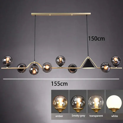 Modern pendant light with smoky grey glass and gold accents featuring multiple amber and white spherical globes for dining room