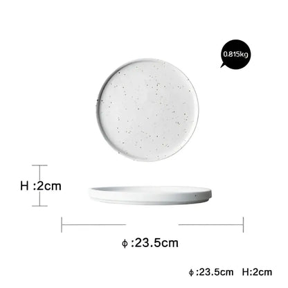 Modern speckled white ceramic dinner plate set featuring a flat circular dinner plate with a slightly raised rim