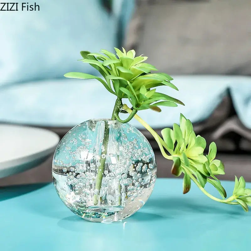 Modern spherical clear glass vase with bubbles holding a green succulent plant for decorbites clear glass decor