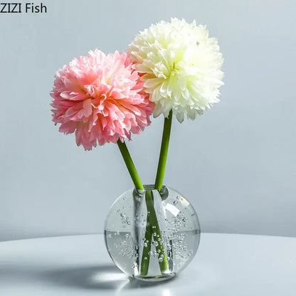 Modern spherical clear glass vase with bubbles holding pink and white fluffy flowers for decorbites clear glass decor