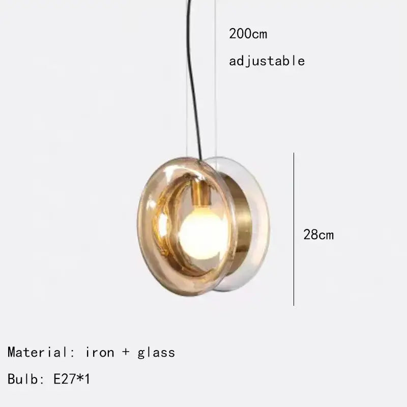 Modern spherical glass pendant lights with brass metallic accents for dining room or living space lighting