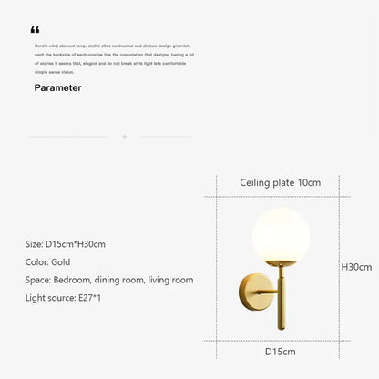 Modern wall lamp with a gold finish and spherical frosted glass shade perfect for bedroom lighting