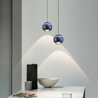 Modern spherical led bedside pendant lights with deep blue metallic finish and silver accents for bedroom decorbites decor
