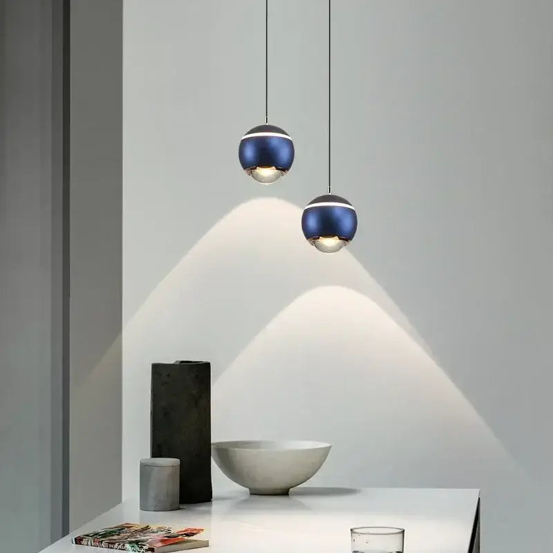 Modern spherical led bedside pendant lights with deep blue metallic finish and silver accents for bedroom decorbites decor