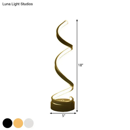 A sleek 18-inch tall gold spiral led floor lamp with illuminated curves in black white gold finish for task light