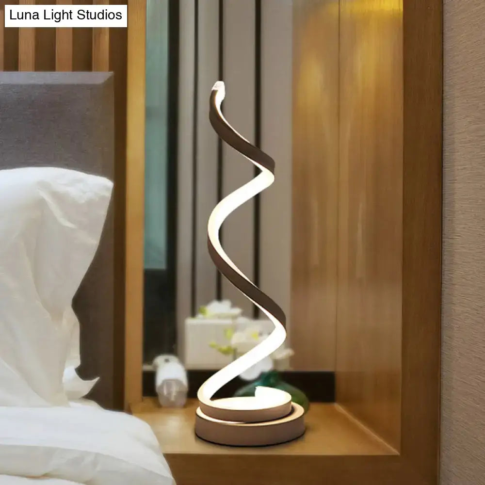 Modern spiral black white gold led table lamp with sleek curved design and warm white illumination for bedroom task light
