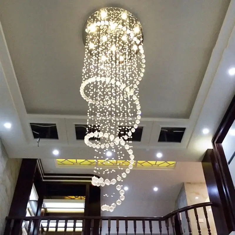 Modern spiral crystal led ceiling chandelier by decorbites with cascading clear faceted beads emitting warm light