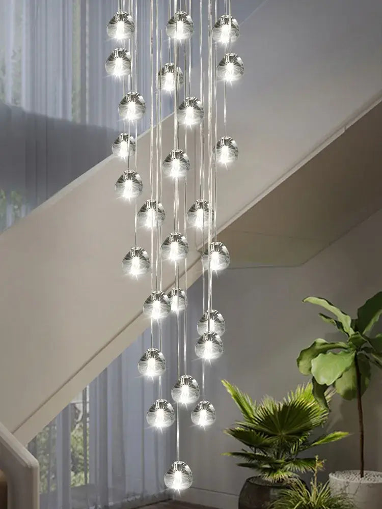 Modern spiral crystal led ceiling chandelier with cascading spherical bulbs suspended by clear cords by decorbites crystal led