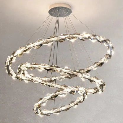 A modern multi-tiered decorbites crystal chandelier with interlocking LED crystal rings for living room decor