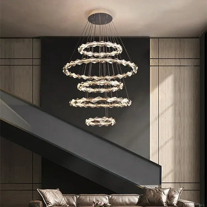 A modern decorbites crystal chandelier with multi-tiered faceted crystal rings and LED lighting for living room decor